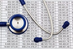 a stethoscope and a medical chart on a table